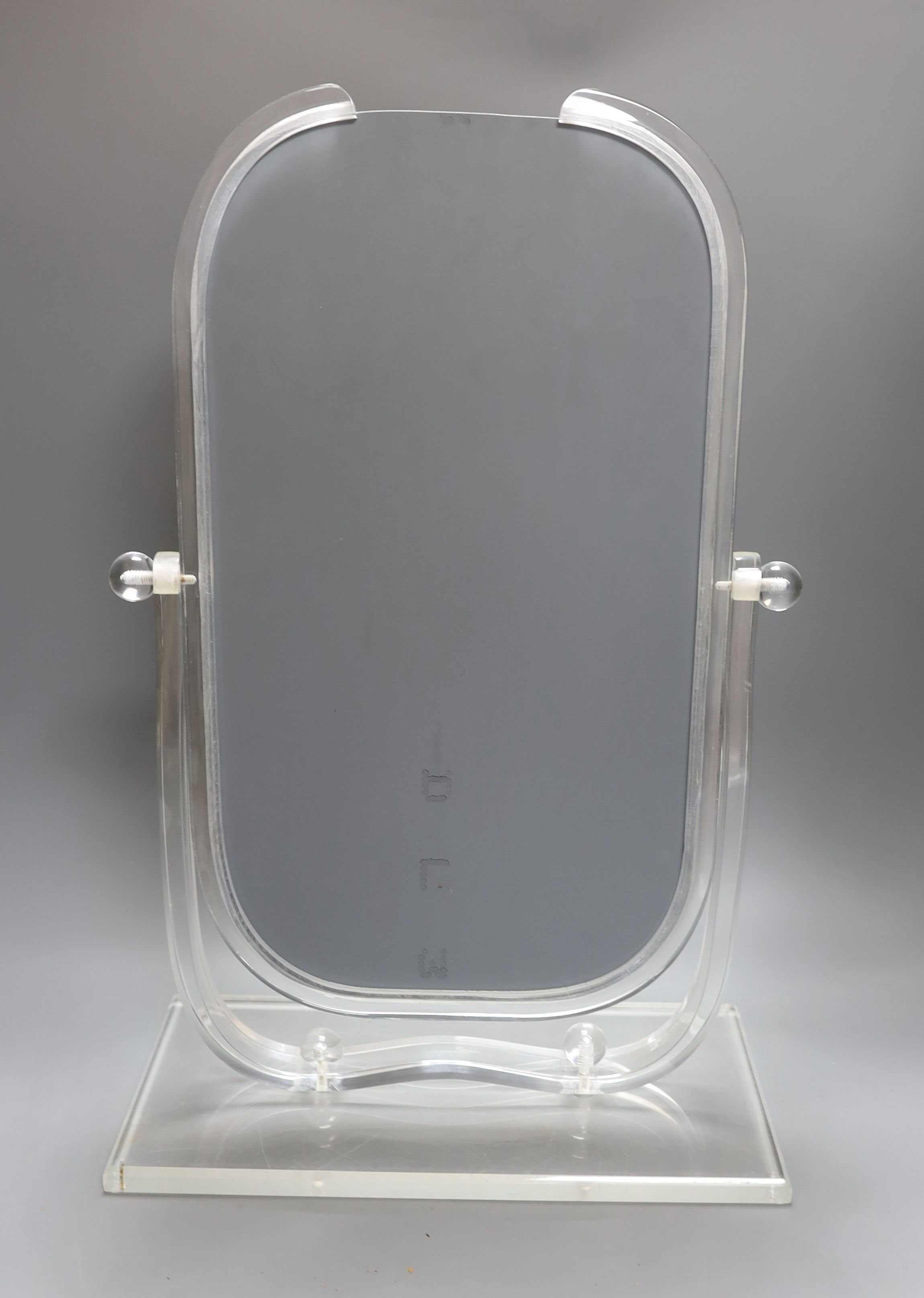 An American Art Deco lucite dressing mirror - 55cm tall